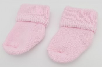 Rosa Babysöckchen liegend 