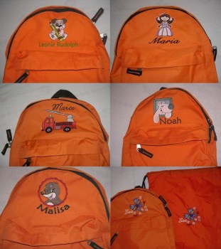 verschiedene orange Kinderrucksäcke mit Motiv und Name bestickt